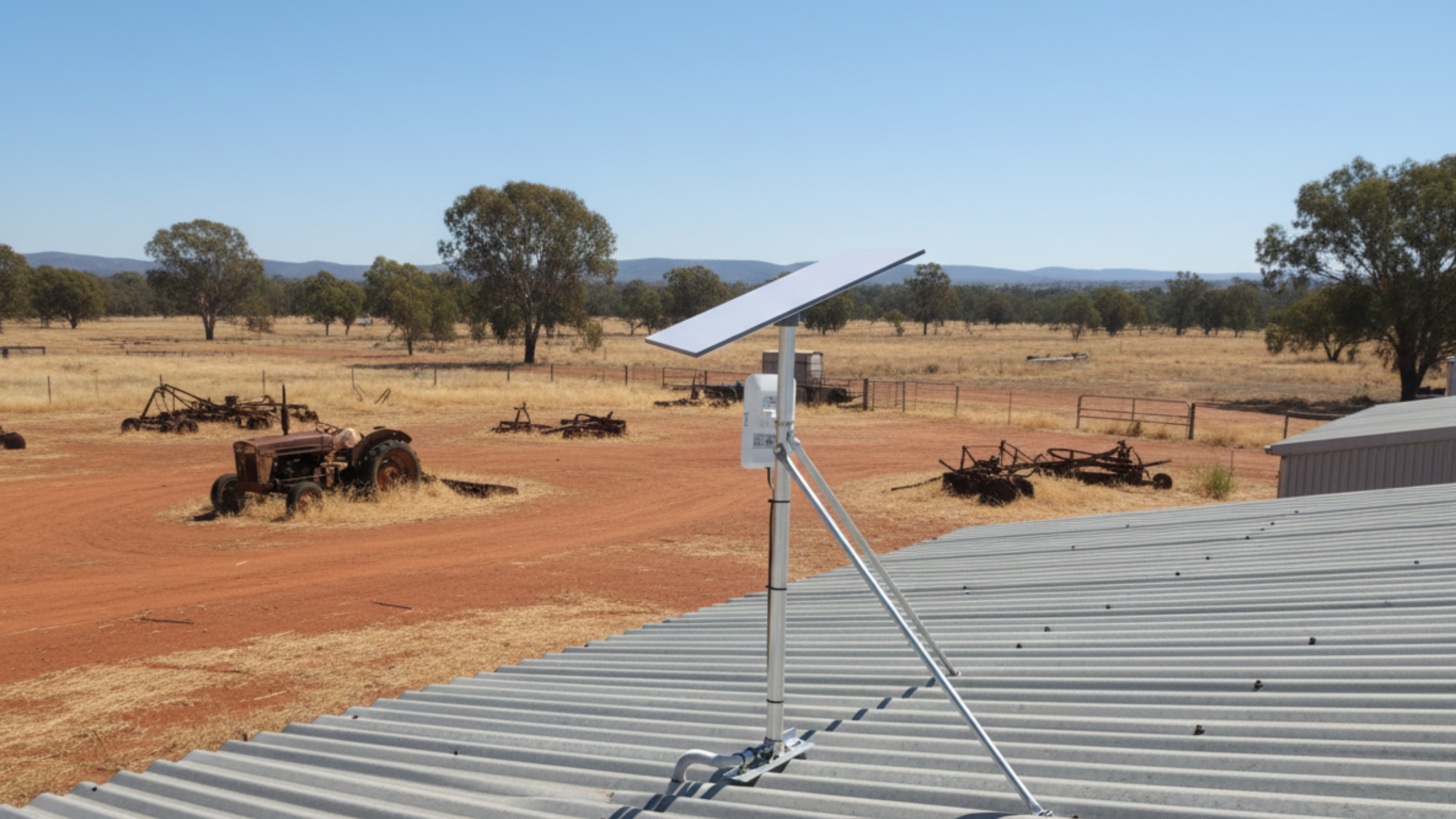Starlink Gen 3 panel on a roof with a rural landscape in the background
