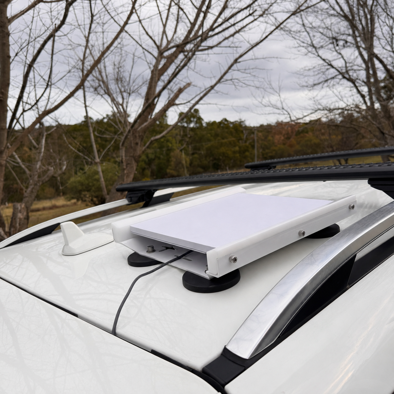 Spacetek Starlink Mini in Motion mount on vehicle with magnets in white