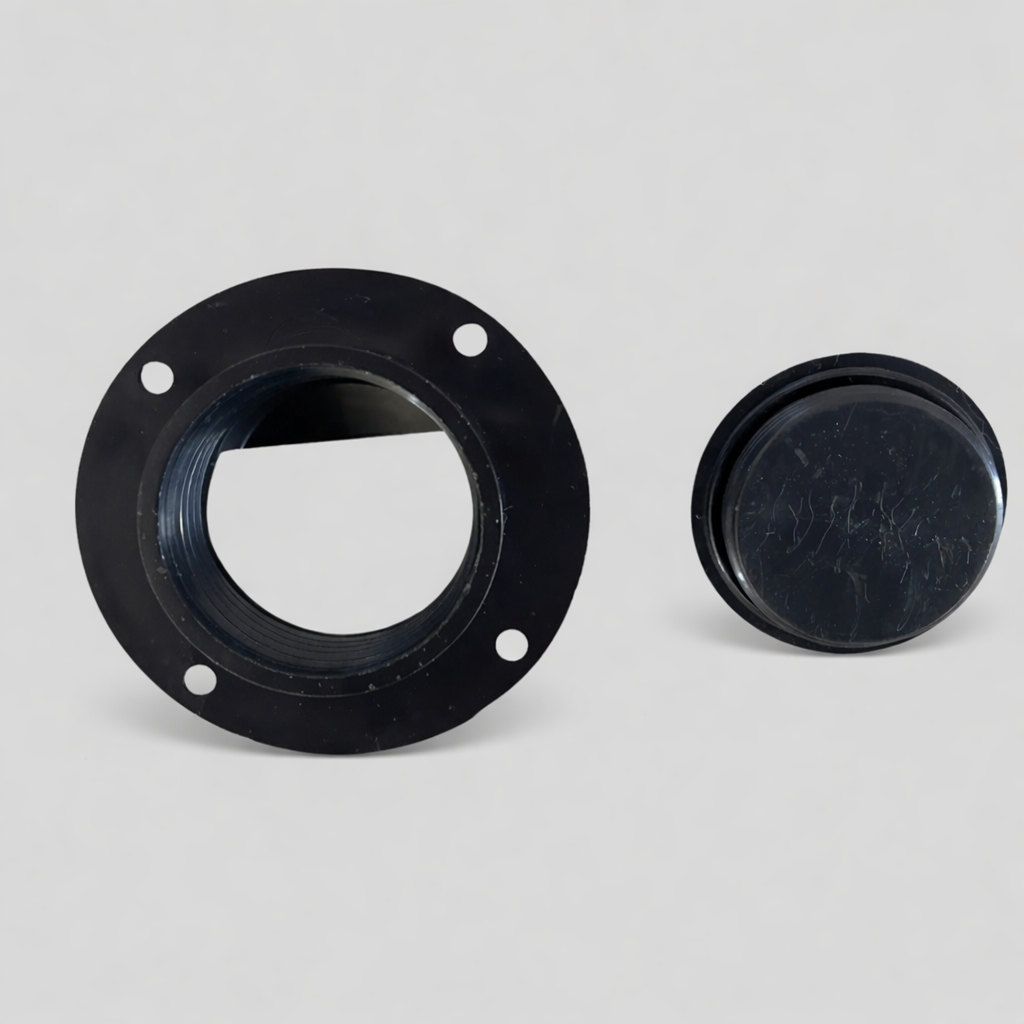 Black threaded flange with four mounting holes and matching screw cap, round plastic fitting with visible wear marks