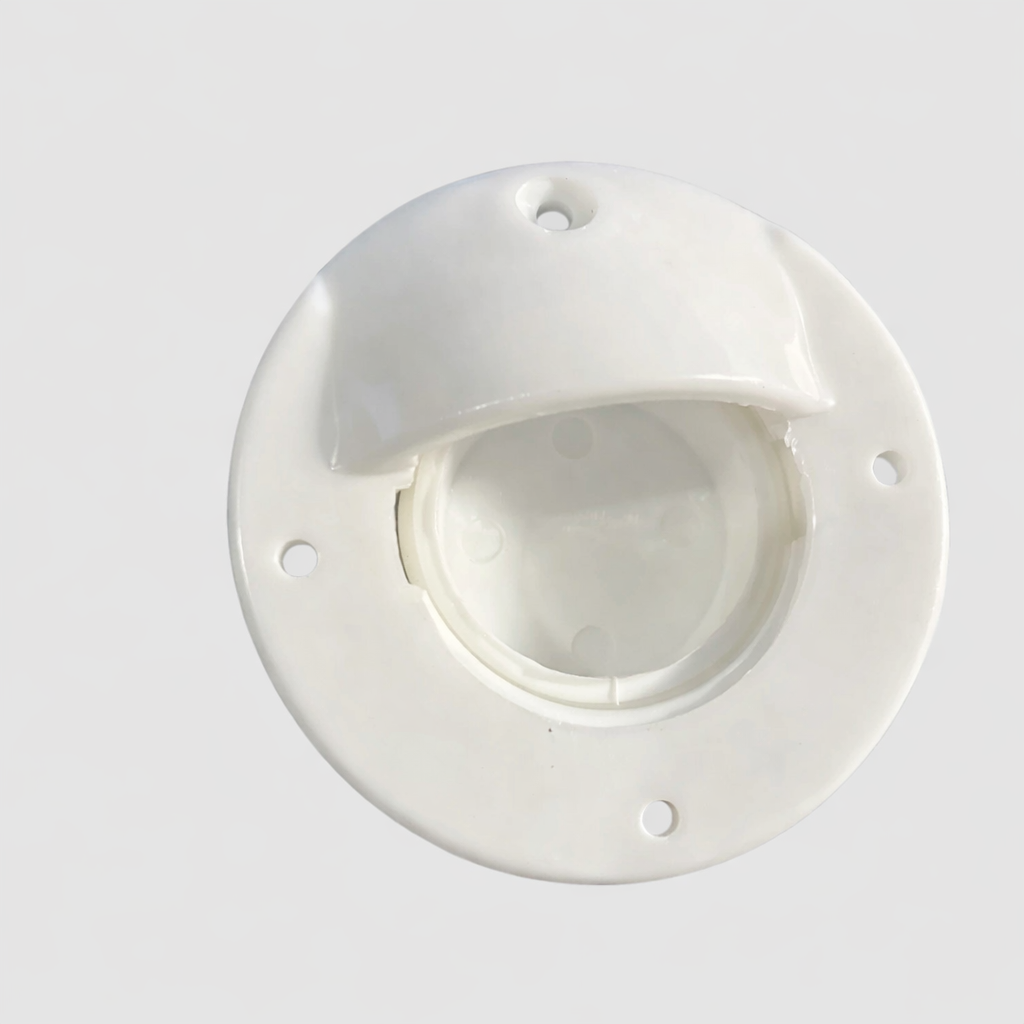Top view of white cable access bung showing screw holes and protective hood for outdoor cable routing