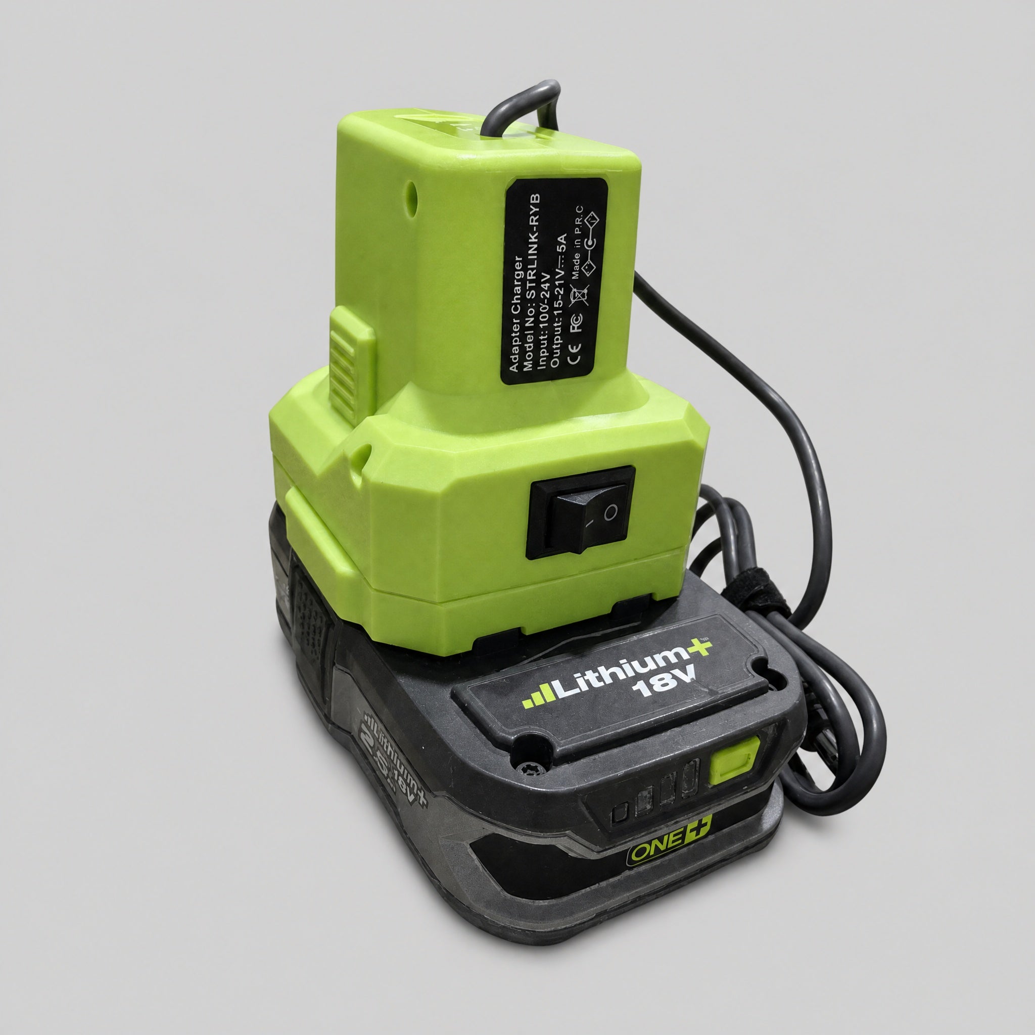 Side view of Ryobi 18V battery adapter with DC cable for Starlink Mini portable power setups.