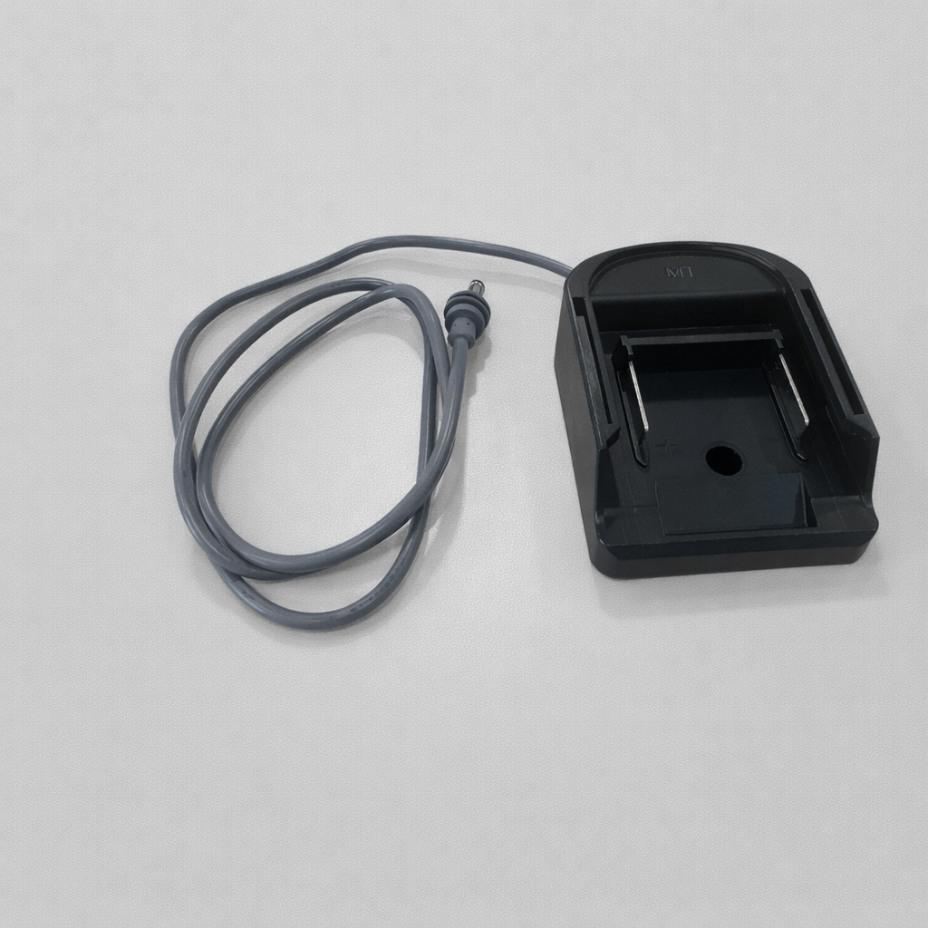 Rear angled view of Spacetek Makita battery adaptor dock for Starlink Mini showing battery slot, metal contacts, and attached DC power cable