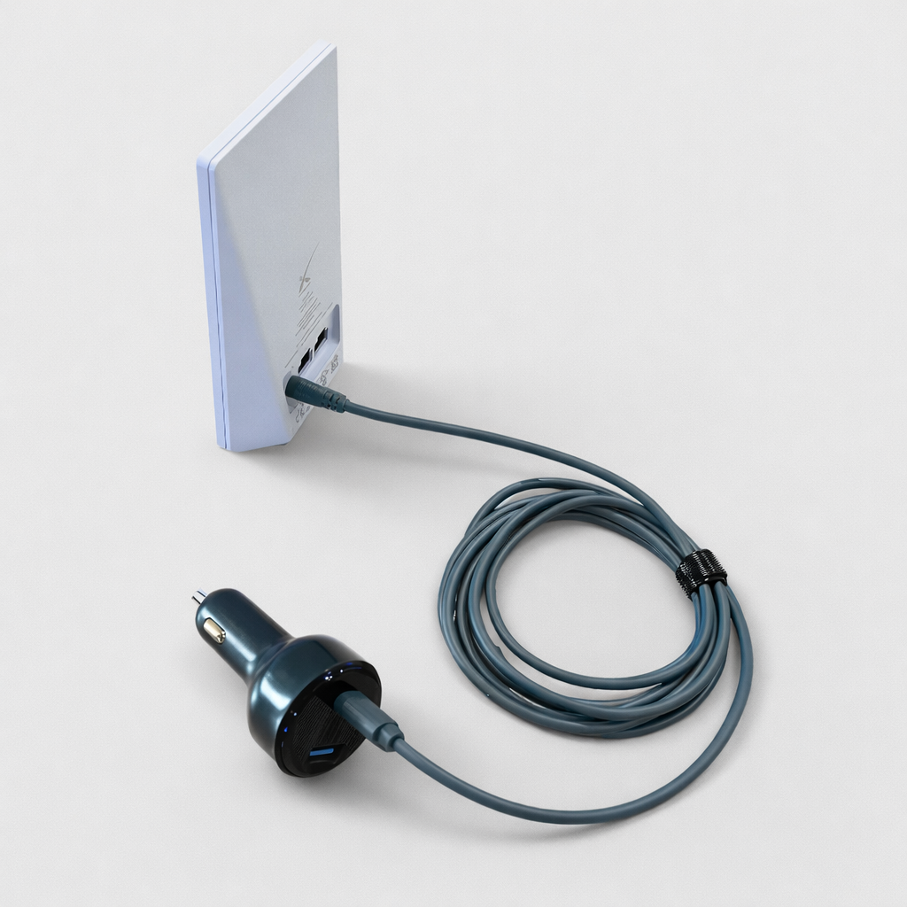 Spacetek Starlink-to-car adapter kit for router mini with a flat white terminal and connected coiled cable ending in a black car charger, photographed on a neutral grey background.