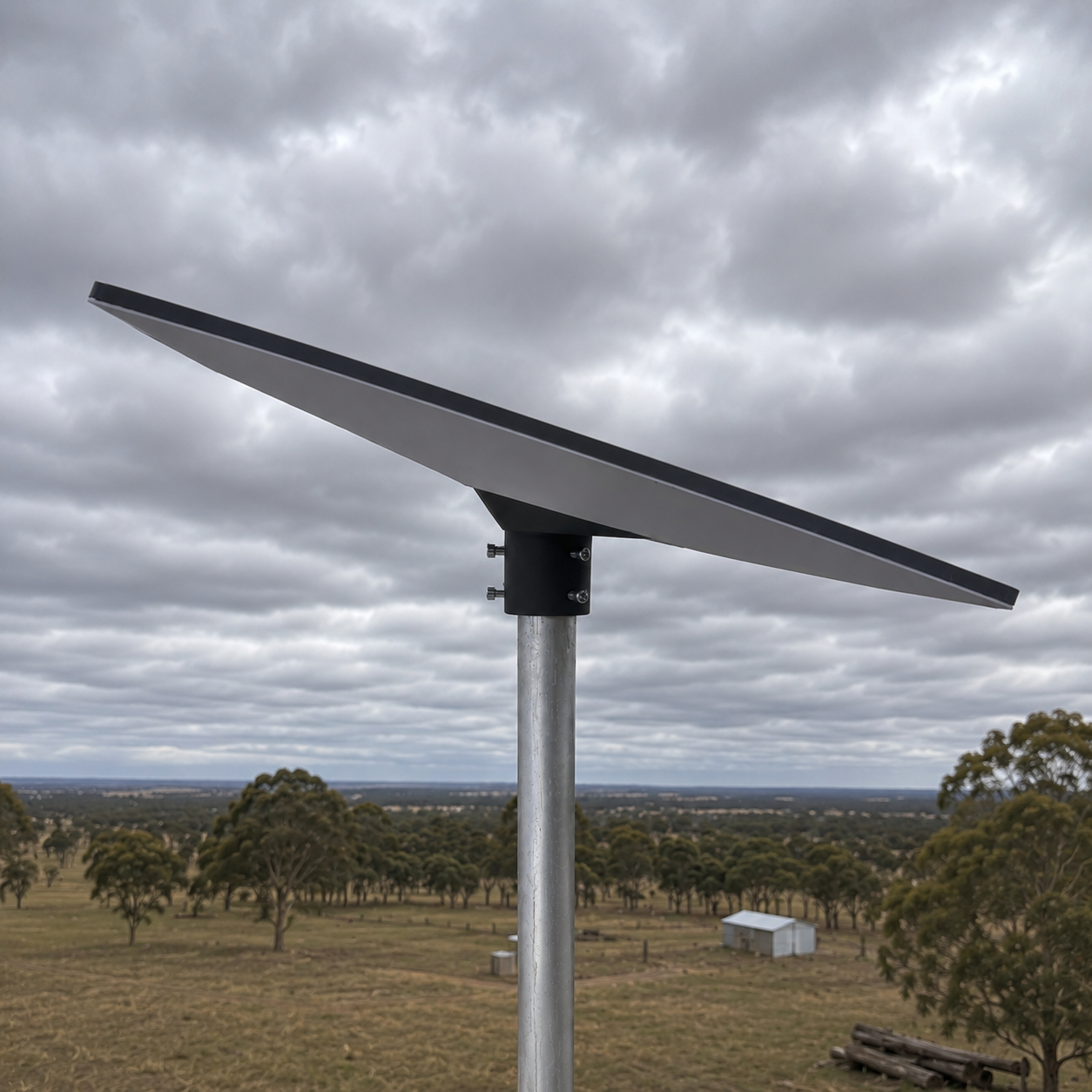 Spacetek Starlink Gen 3 Pole Adaptor mounted on a galvanized steel pole above a rural Australian property, providing a secure mounting solution for Starlink Gen 3 satellite internet installations.
