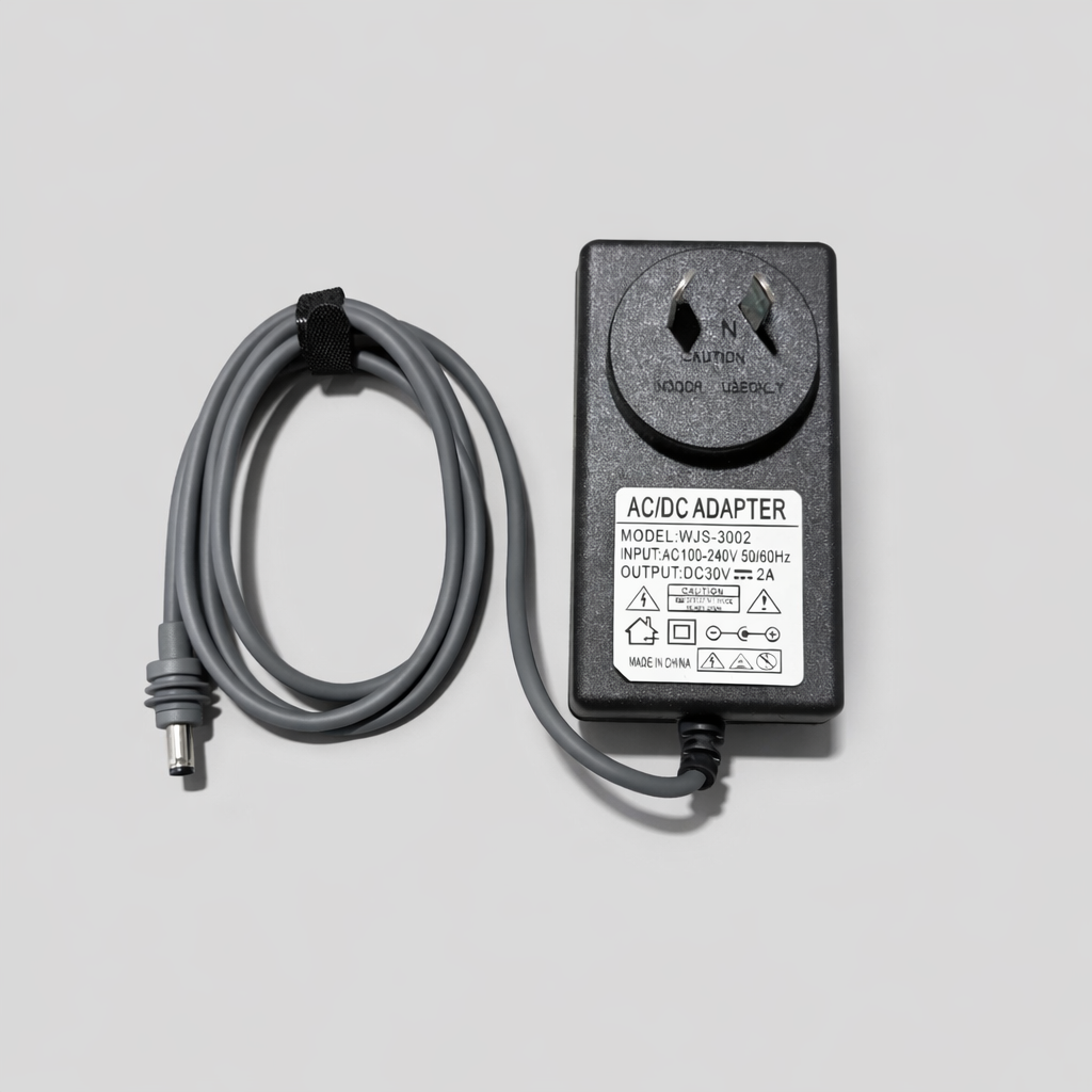 Top view of a Starlink Mini replacement AC/DC power supply with grey cable and Australian plug, photographed on neutral grey background.