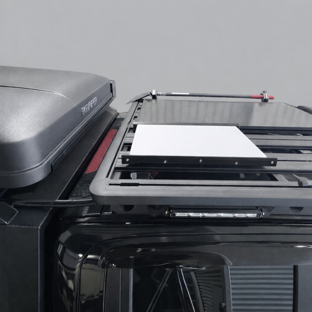 SpaceTek Starlink Gen 3 Motion Mount integrated on a utility vehicle roof alongside a cargo carrier, showing a seamless low-profile installation for off-grid communication