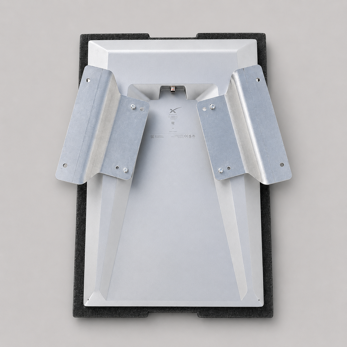 Low-profile view of the raw aluminium flat mount adaptor mounted to a Starlink Gen 3 Performance dish