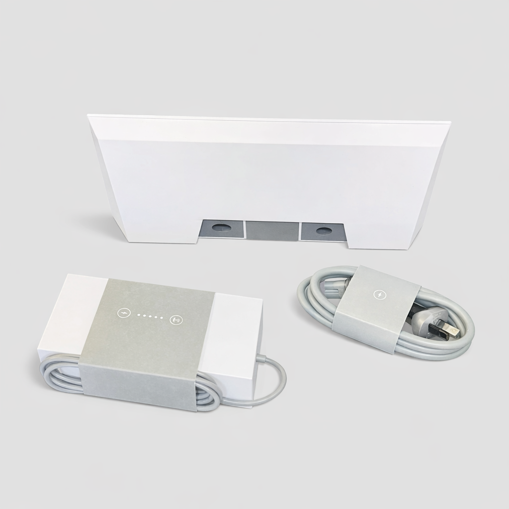 Rear view of the Genuine Starlink Gen 3 Router kit, displaying the router’s back ports and base mount detail, along with the power adapter and coiled cable on a neutral grey background