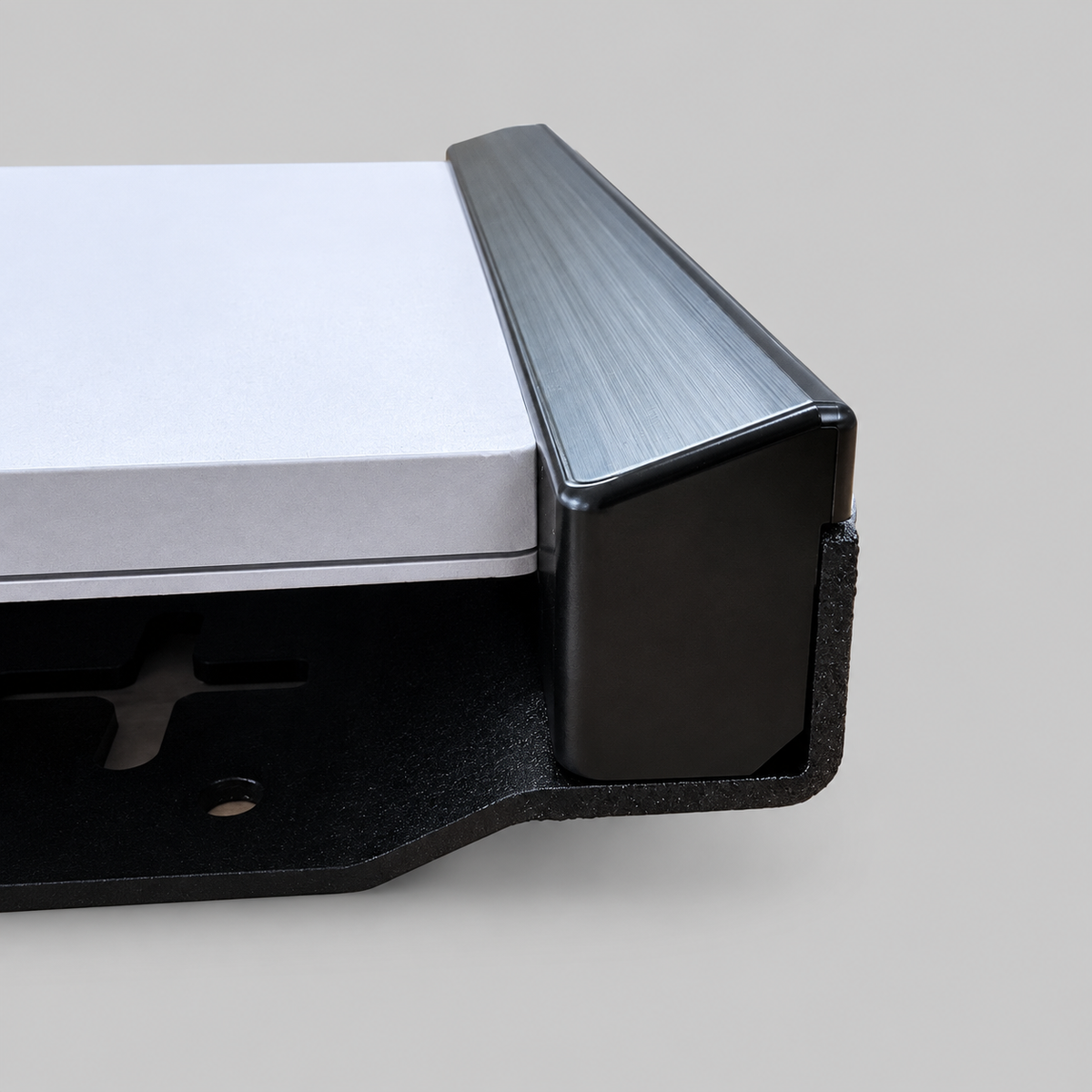 Close-up of Starlink Mini vehicle mount showing black powder-coated aluminium edge protection
