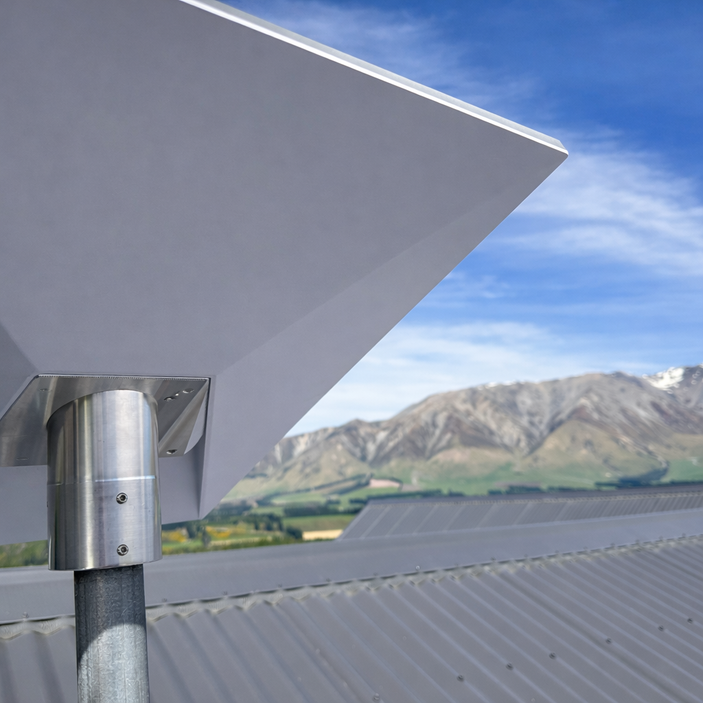 Close-up of Starlink Gen 3 dish mounted with Spacetek heavy duty bracket on tin roof, overlooking New Zealand mountain landscape
