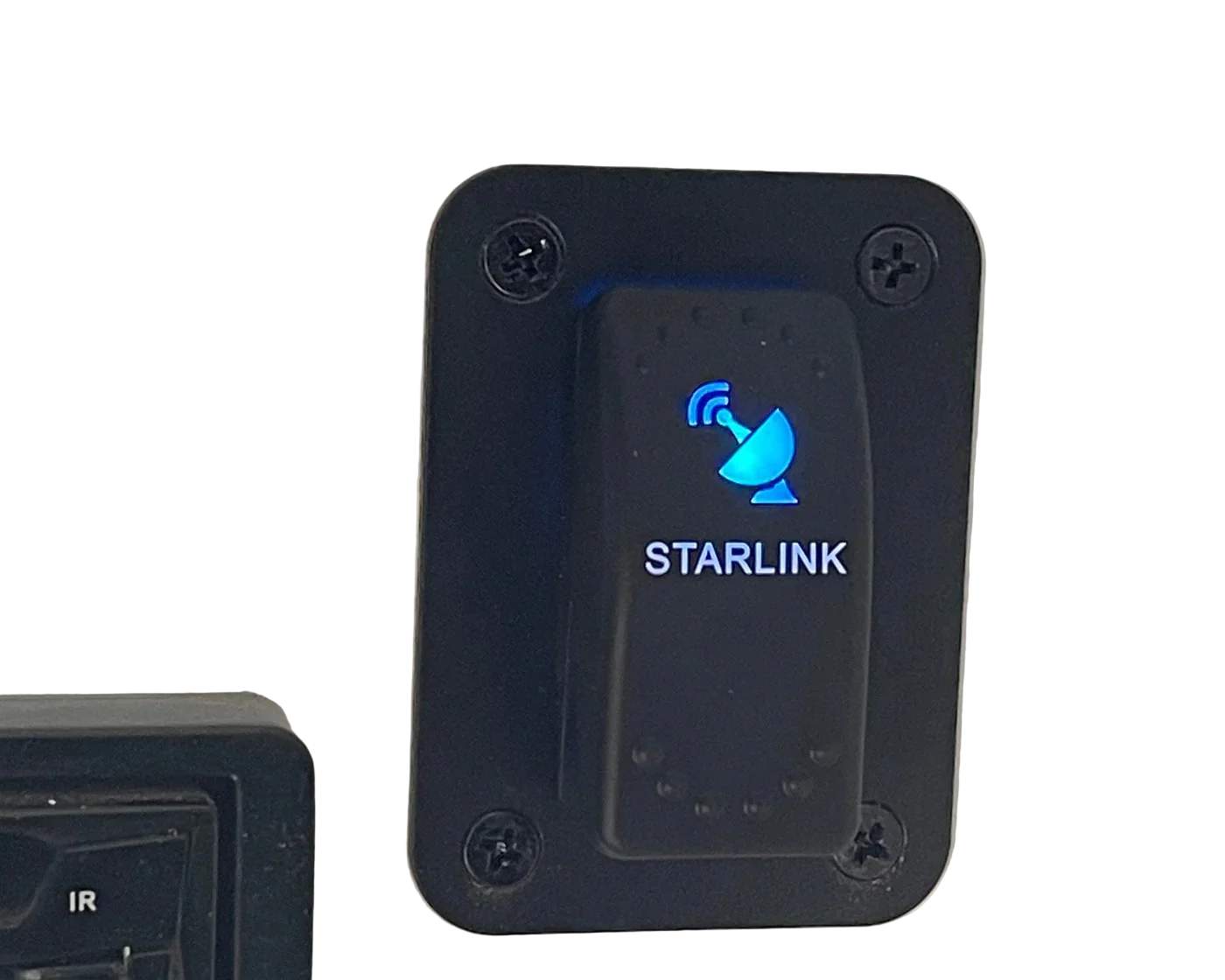 Backlit Starlink rocker switch mounted in panel for powering mobile Starlink Mini systems